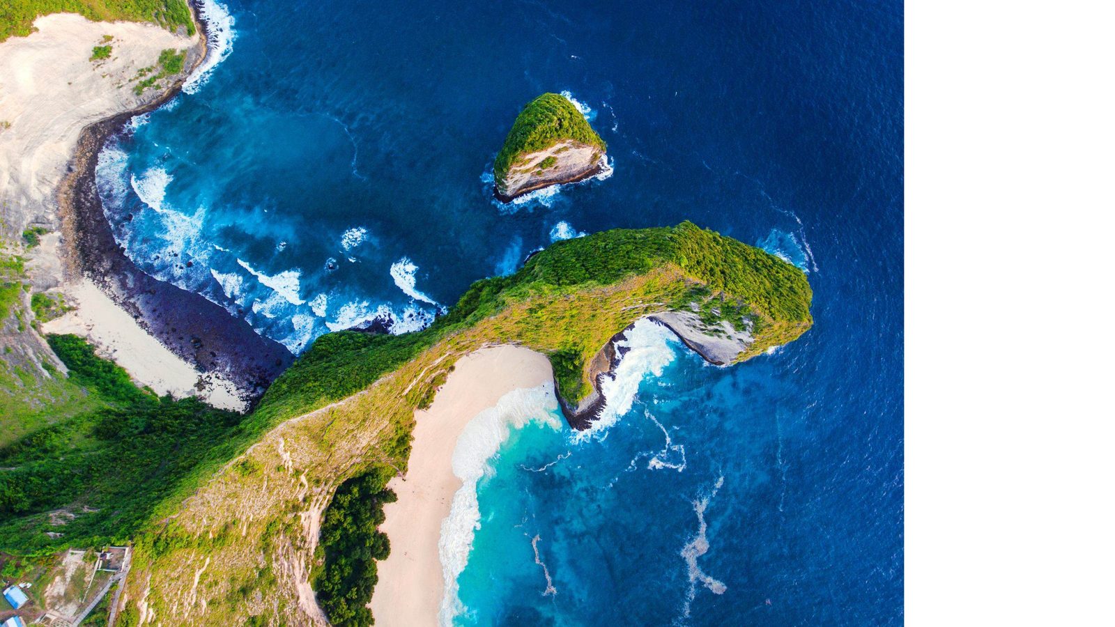 Nusa Penida's cliffs, coves and reef shallows from the air