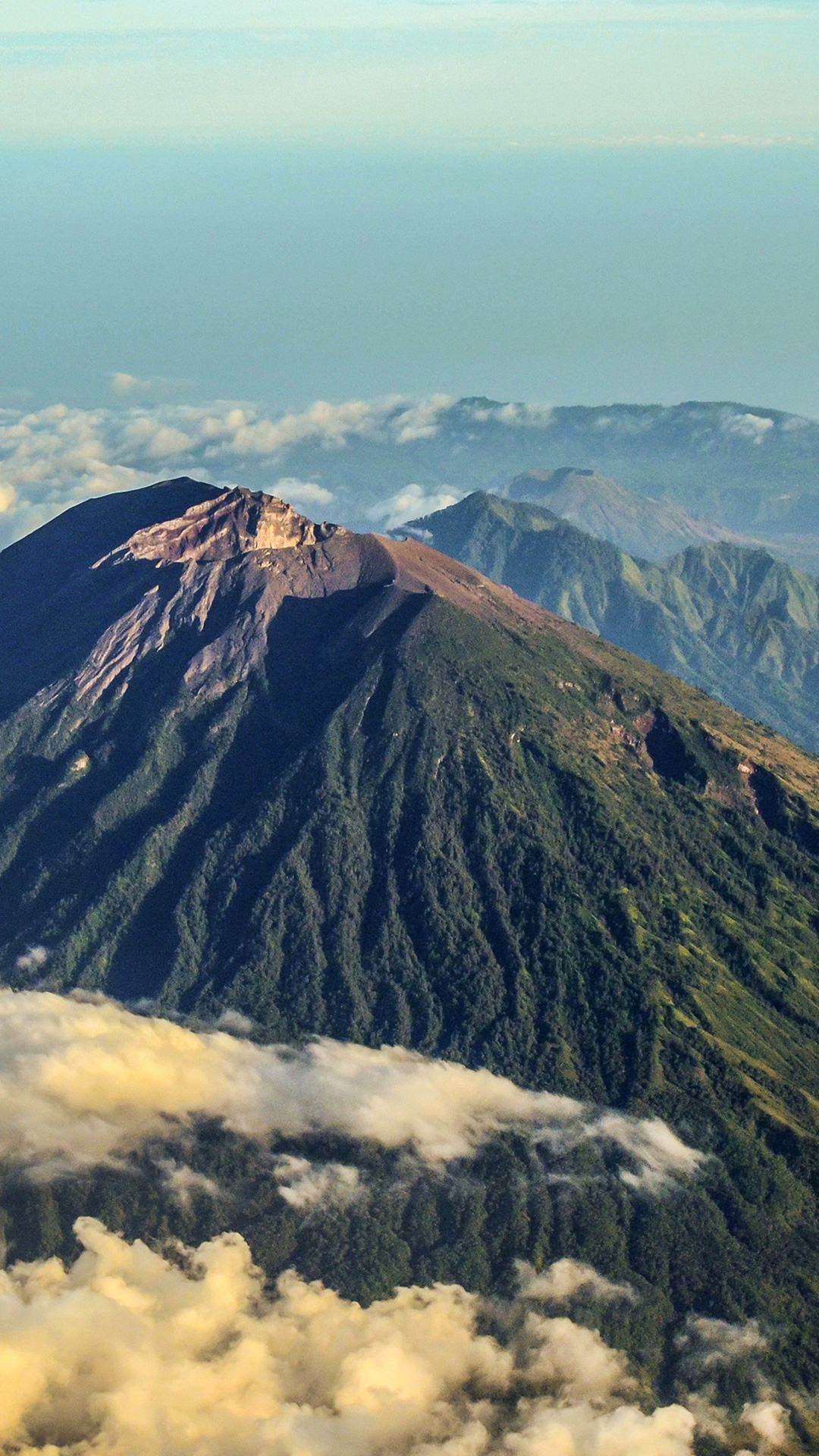 The cone of Mount Agung standing above the cloud